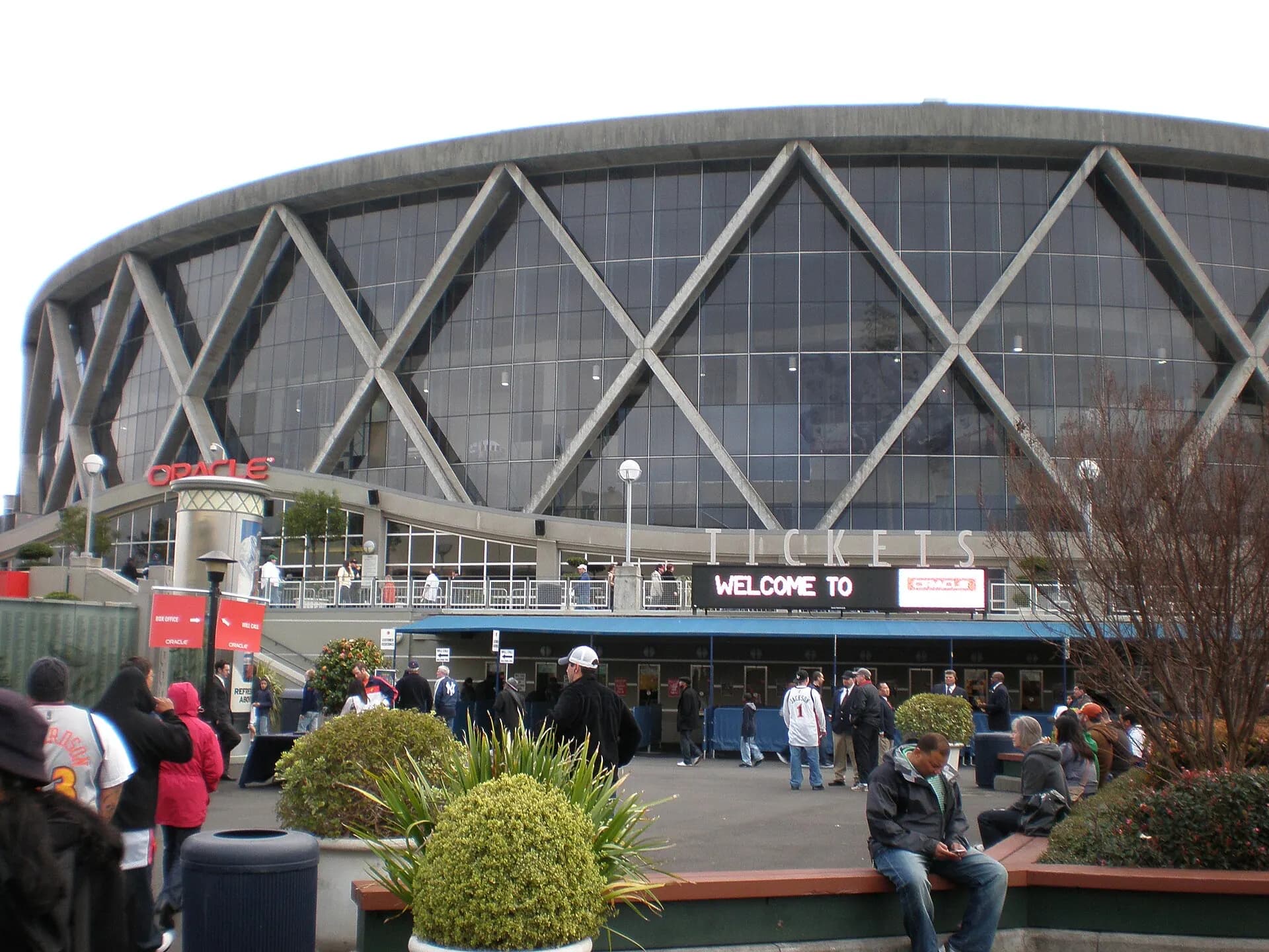 Wide exterior view of the Oakland Arena building and entrance plaza.