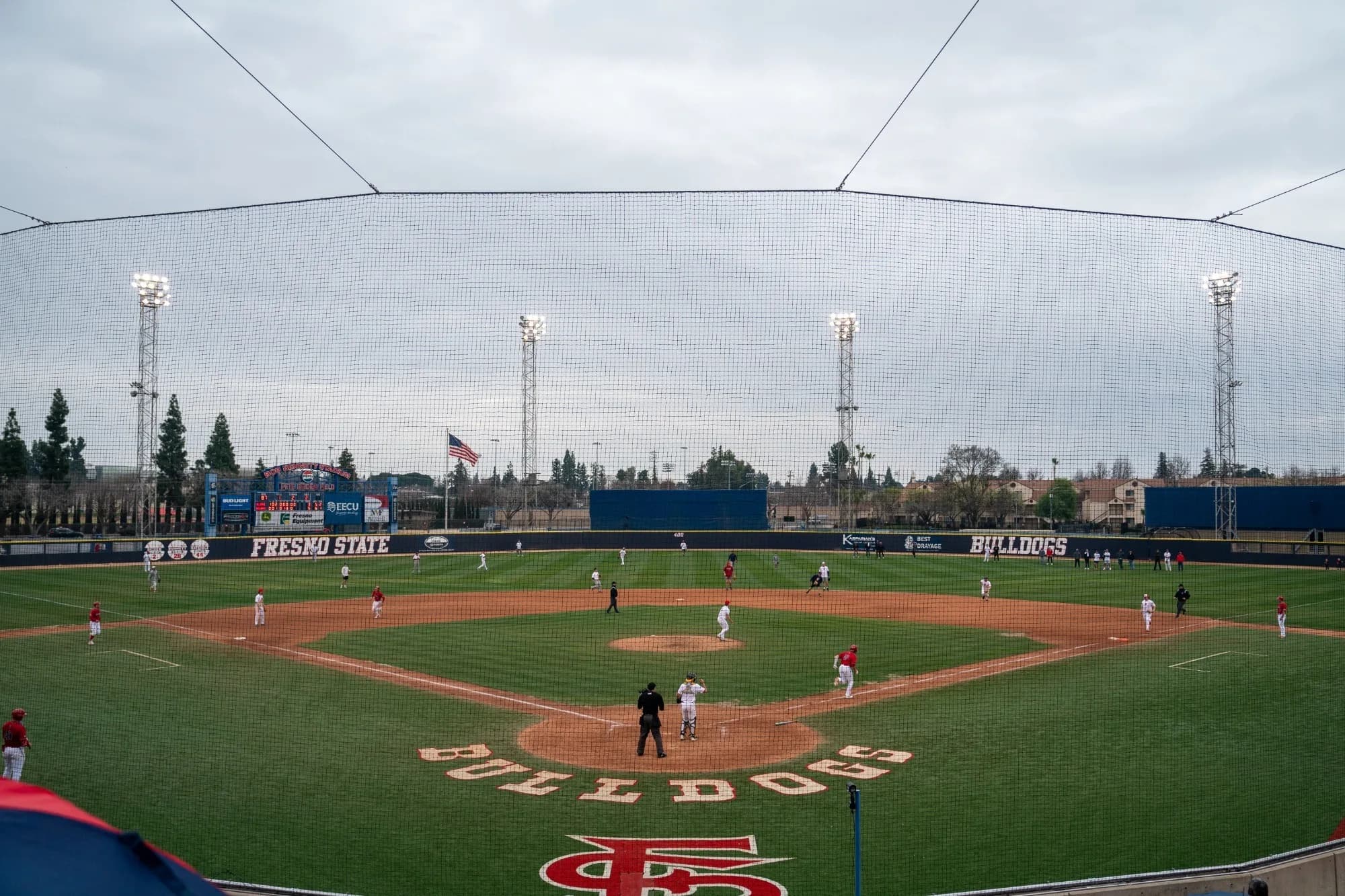 Pete Beiden Field at Bob Bennett Stadium’s diamond and outfield in Fresno State Athletics’ actual facility photograph. Protective netting and the foreground edge remain visible. No individual capture date or numbered camera seat is supplied; compare the actual ticket and current venue instructions.