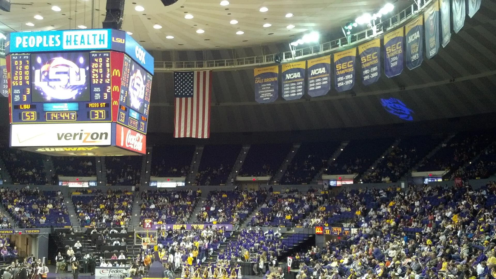 The basketball court, seating bowl, and championship banners inside the Pete Maravich Assembly Center.
