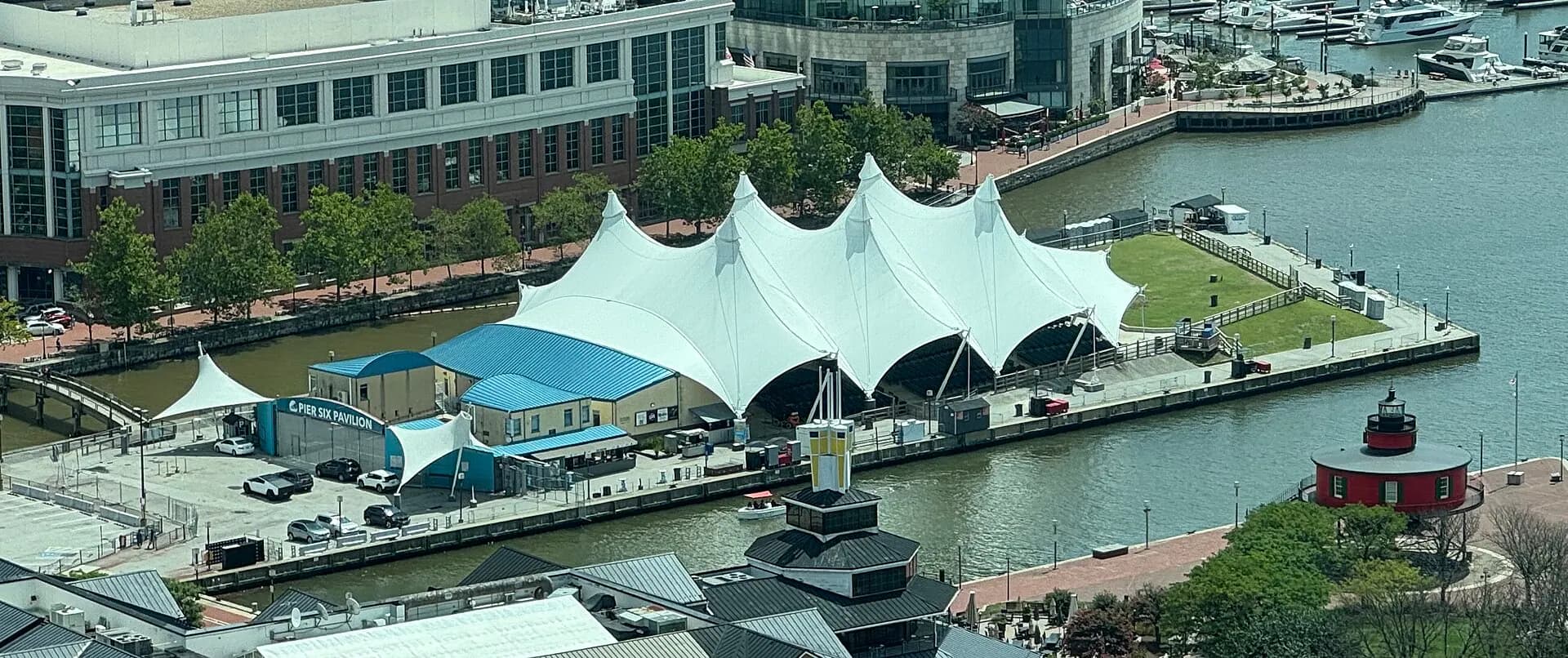 Panoramic exterior view of Pier Six Pavilion beside Baltimore's Inner Harbor.