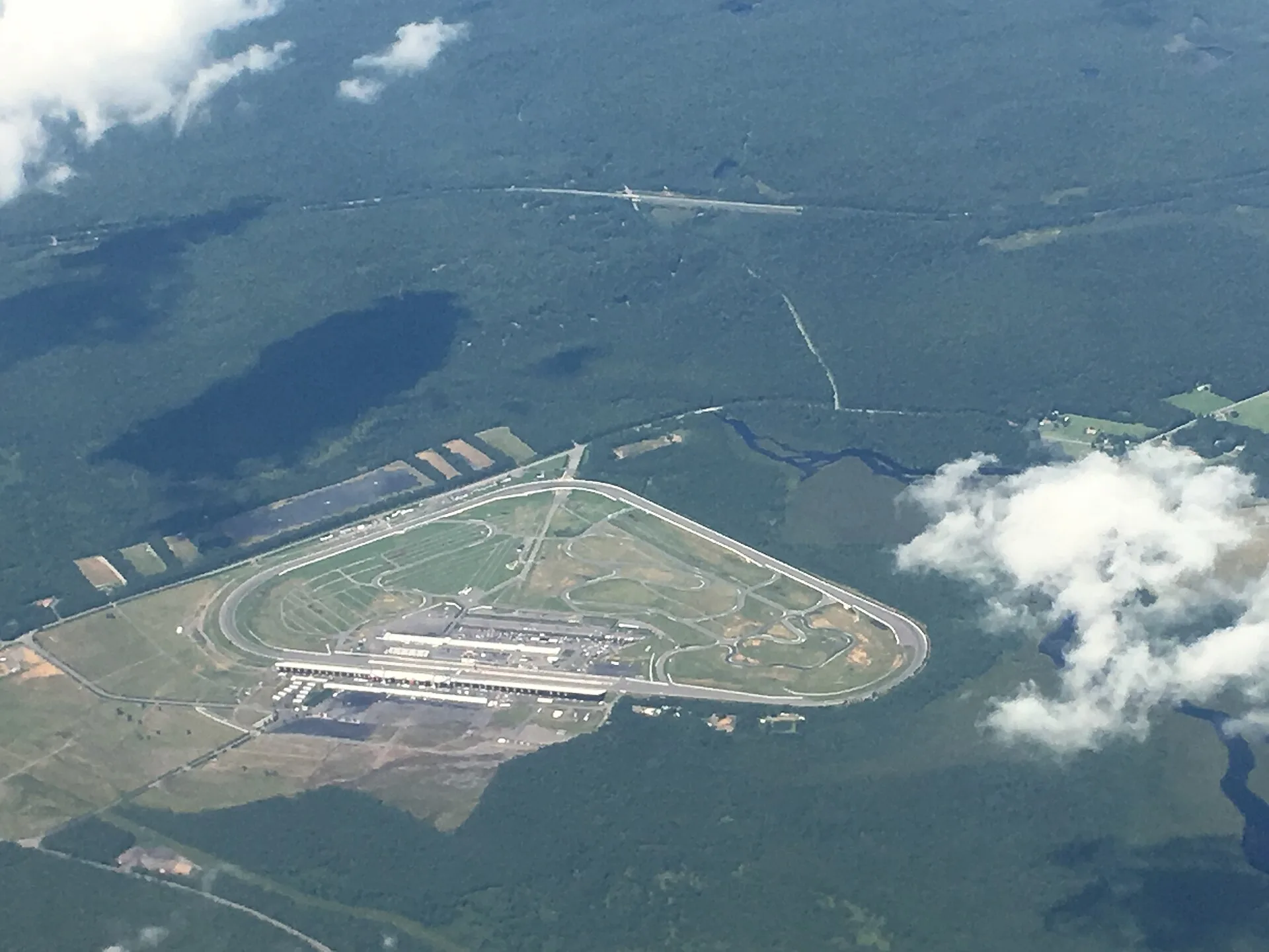 Aerial view of Pocono Raceway in Long Pond. Source photograph dated 2018; signage and event setup may differ.