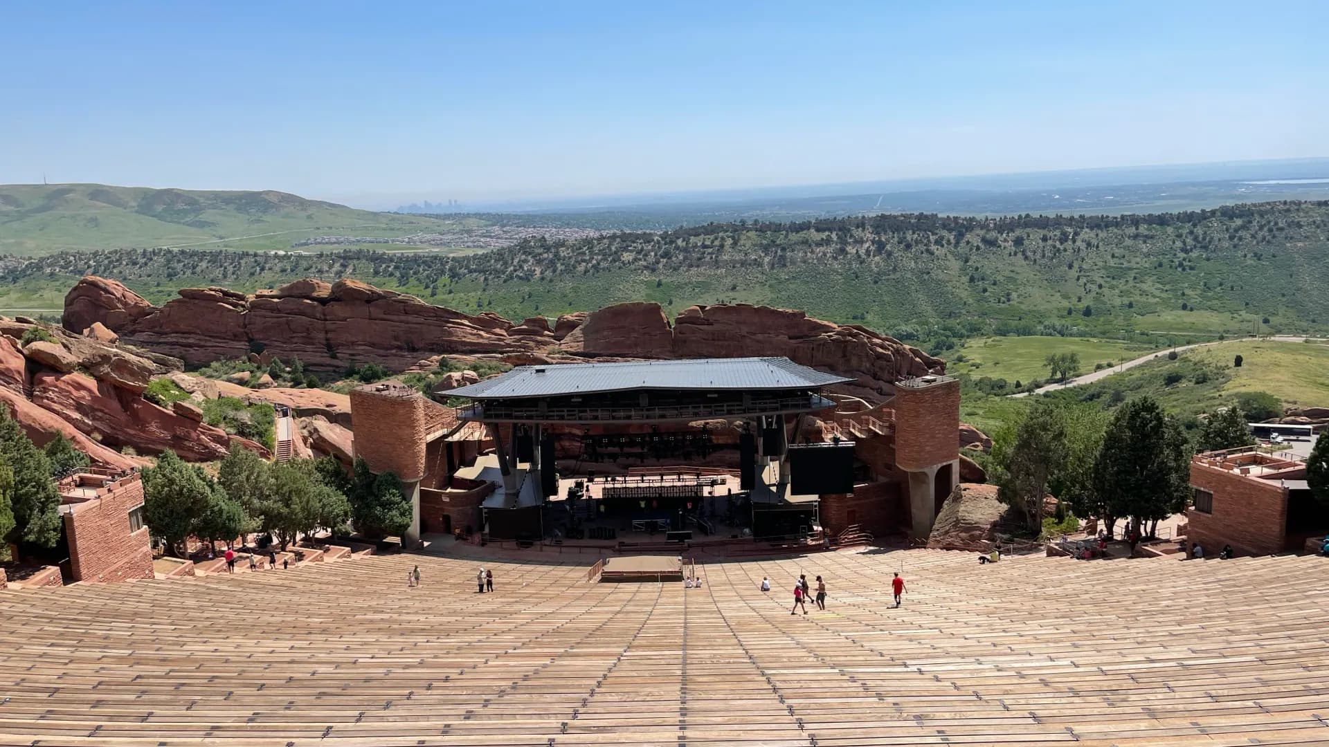 Current top-of-bowl view showing Red Rocks Amphitheatre's complete seating, stage, rock formations, and landscape.