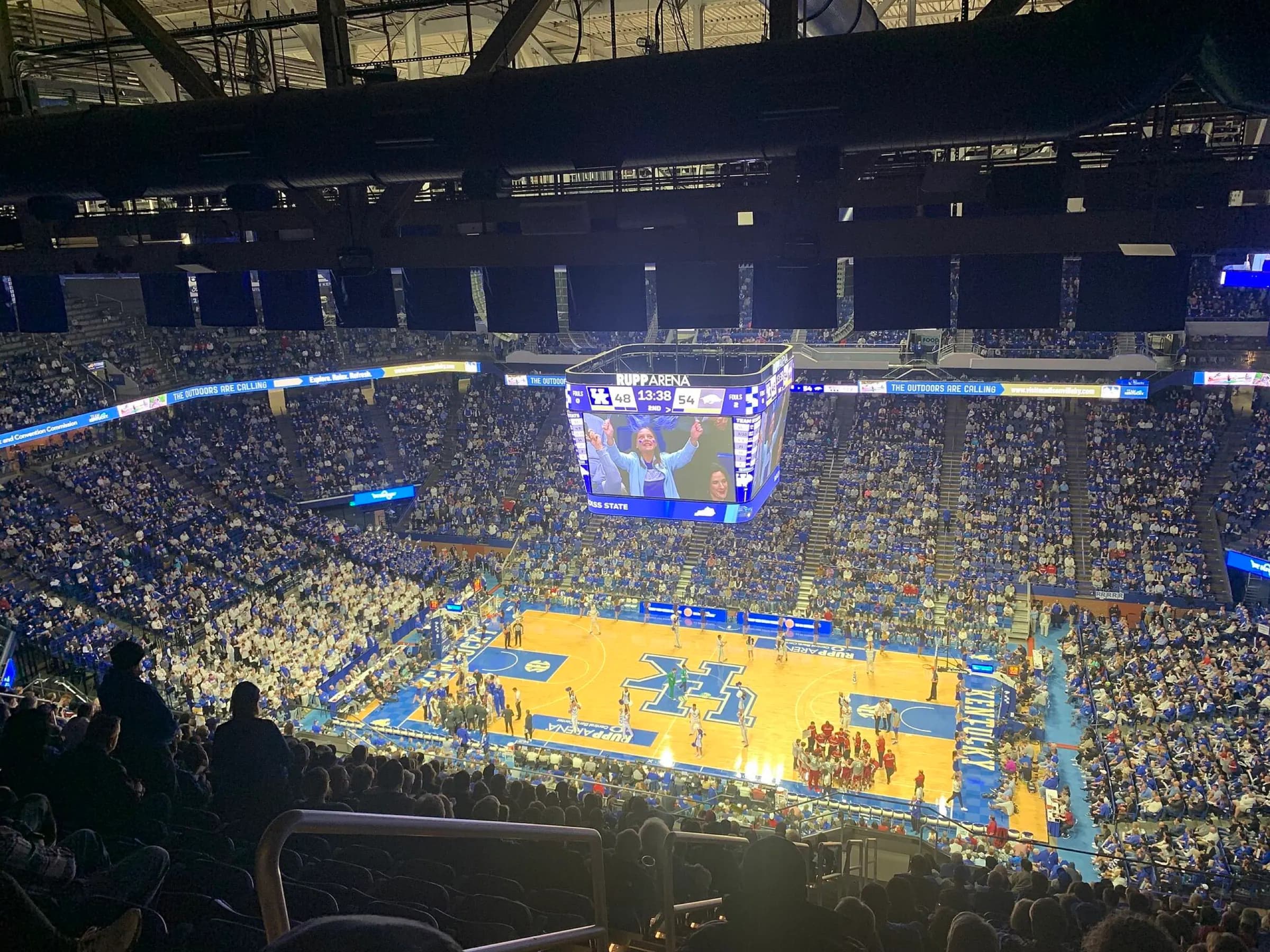 Packed Rupp Arena seating bowl and court during a Kentucky basketball game.