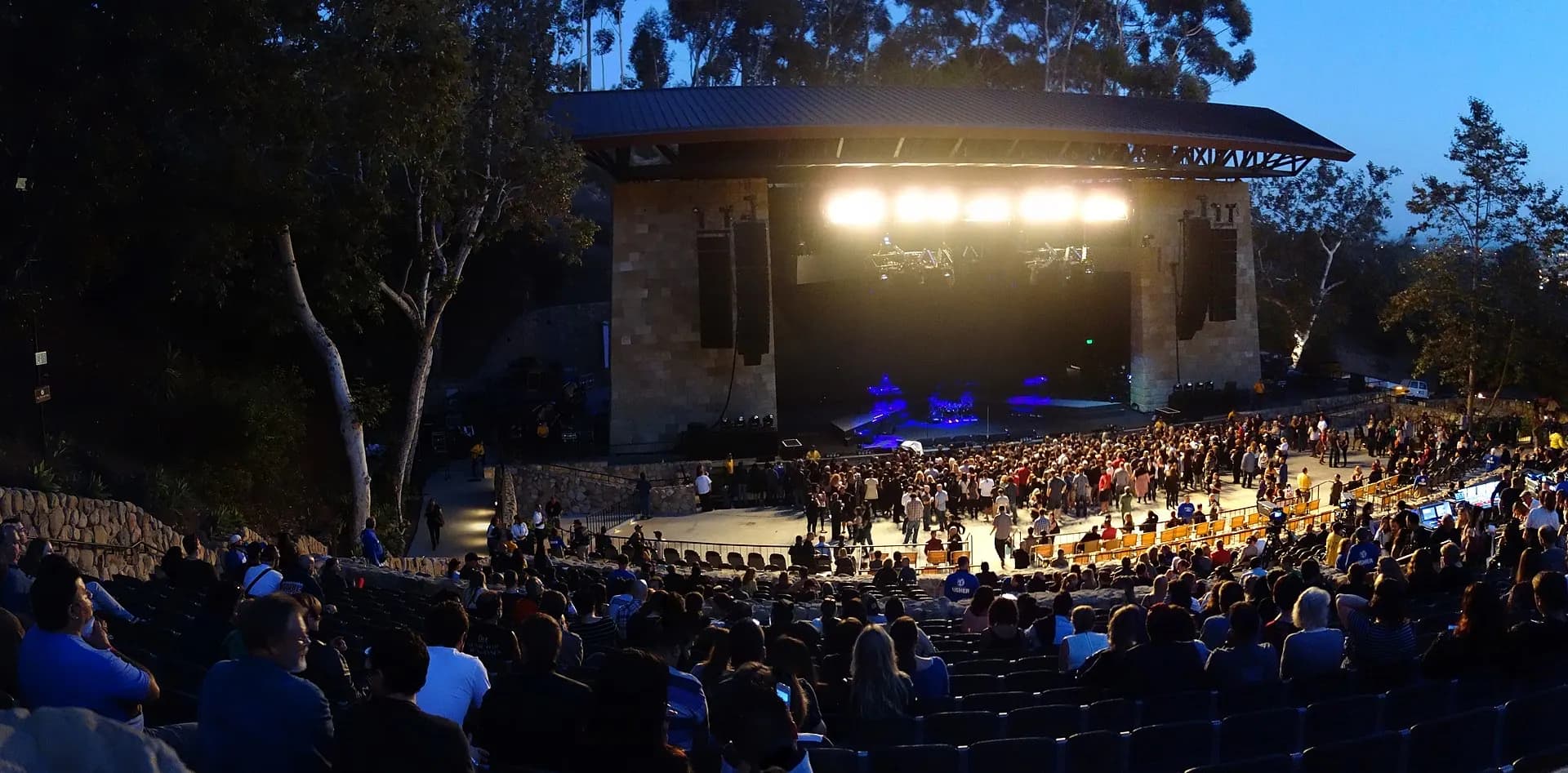 Santa Barbara Bowl stage, terraced seating, and audience before a concert.