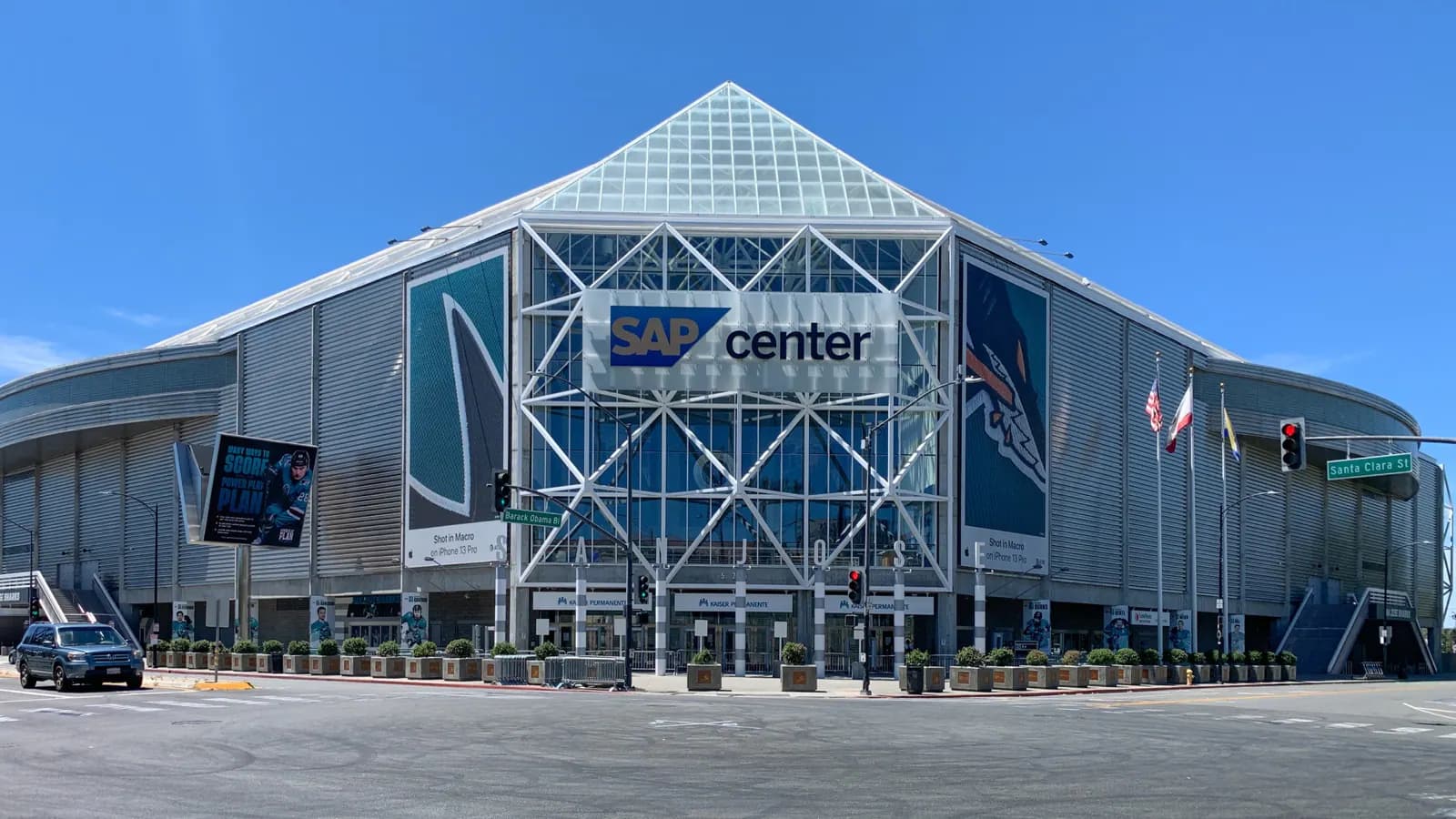 Straight-on exterior view of SAP Center's entrance, facade, and current arena sign in San Jose.