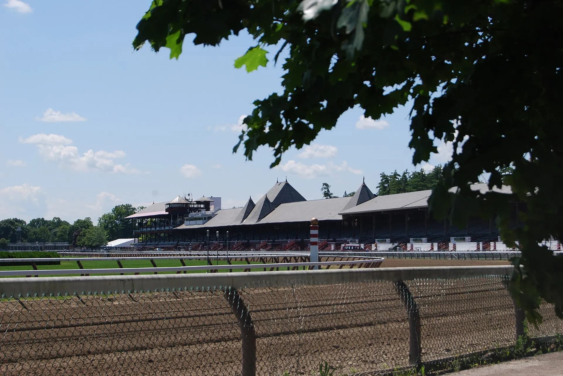 Wide view across Saratoga Race Course toward the grandstand and track.