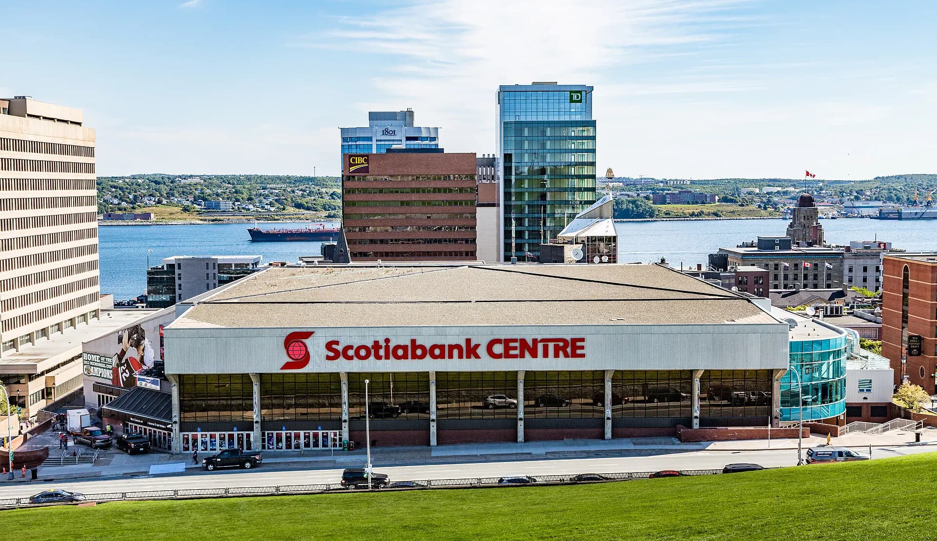 Wide exterior of Scotiabank Centre with downtown Halifax and the harbour beyond