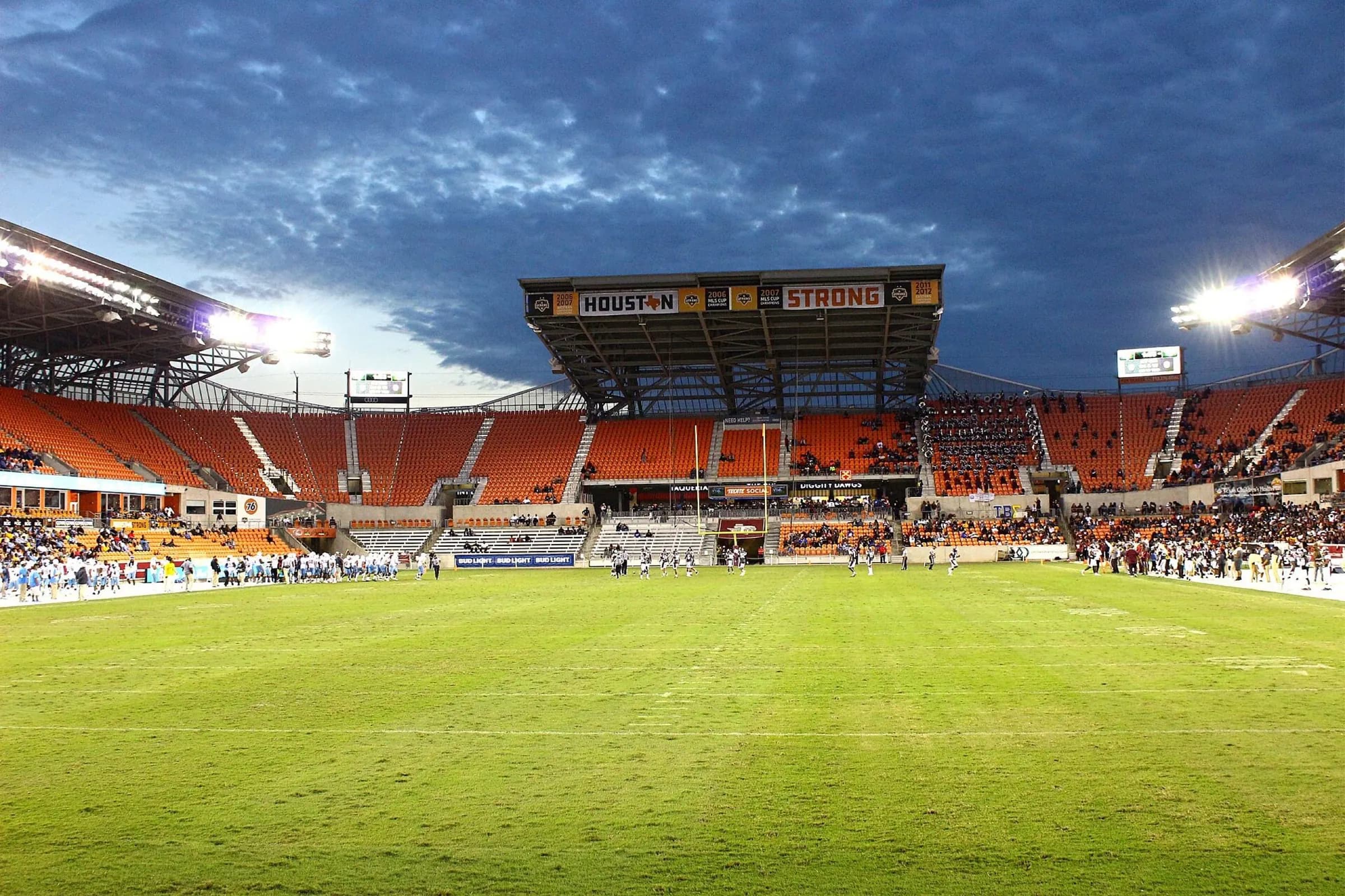 Wide match-day view across Shell Energy Stadium's pitch and seating bowl.