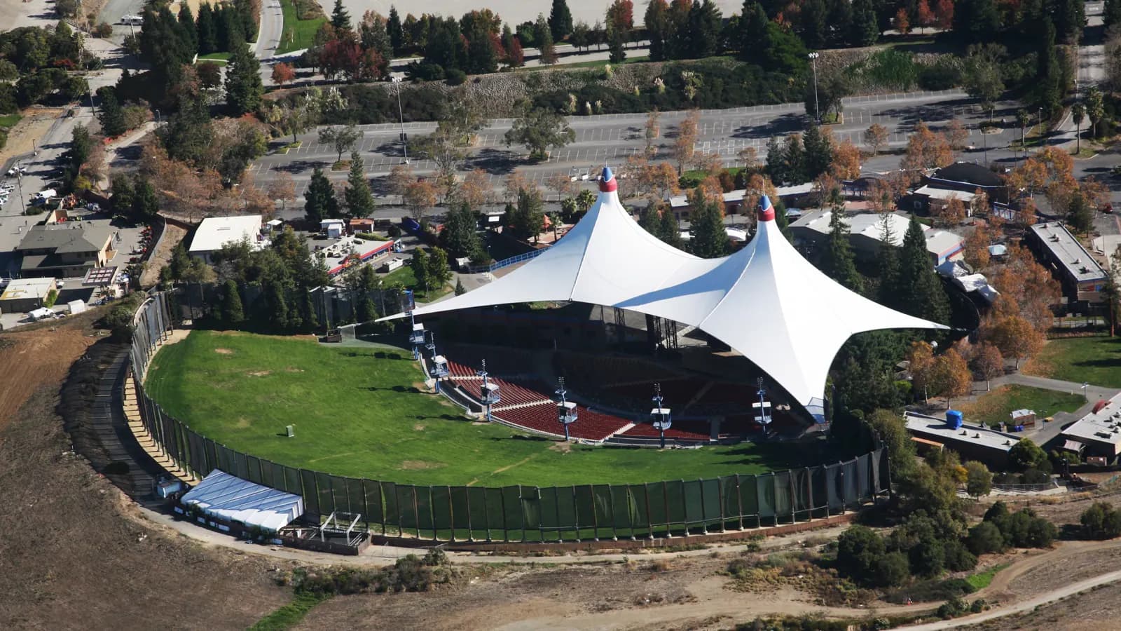 Aerial view of Shoreline Amphitheatre showing its tented stage, reserved seating, and lawn.