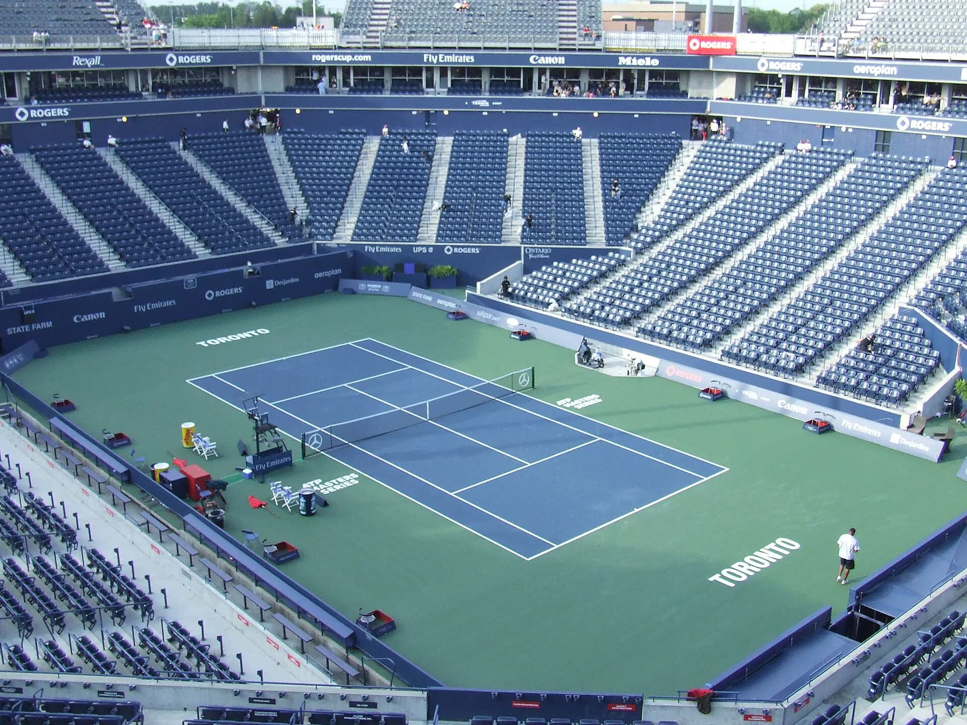 Wide interior view of the tennis court and seating bowl at Sobeys Stadium in Toronto
