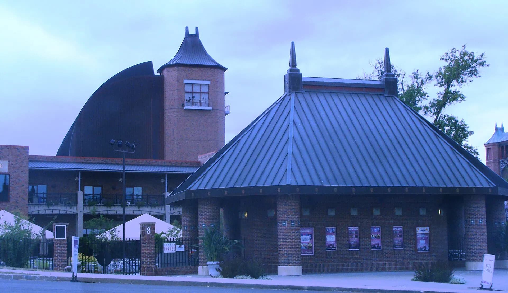 A broad exterior view of Starlight Theatre's entrance and distinctive stage roof in Kansas City.