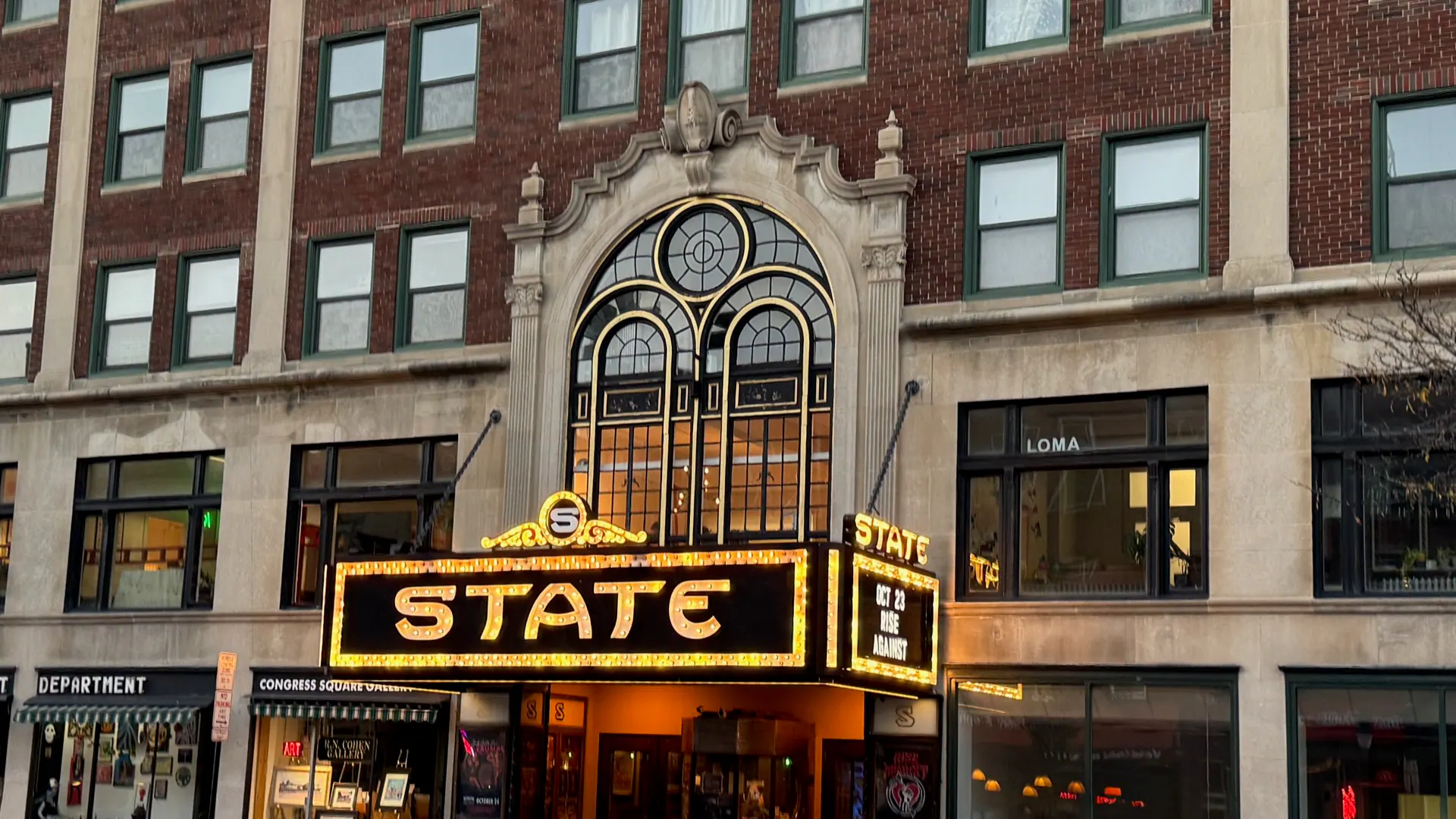 The State Theatre's facade and illuminated marquee in Portland, Maine.