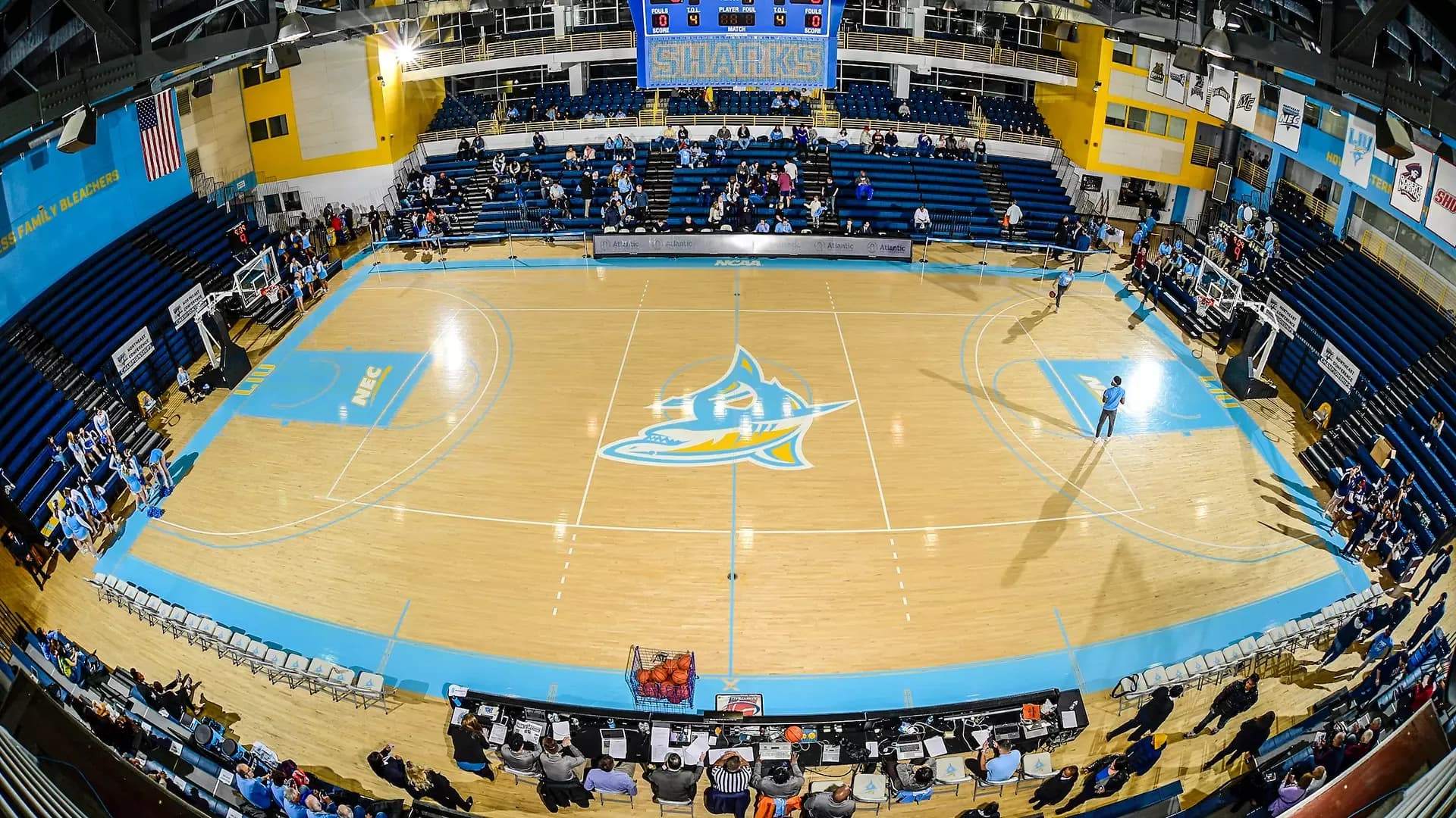 Brooklyn Athletic Center, also identified as Steinberg Wellness Center on LIU tickets, in the official facility collection. This April 2020-source panorama shows the basketball court, blue seating banks and railings; the upload date does not establish capture date or today’s allocations. The elevated view is not an identified ticketed seat.