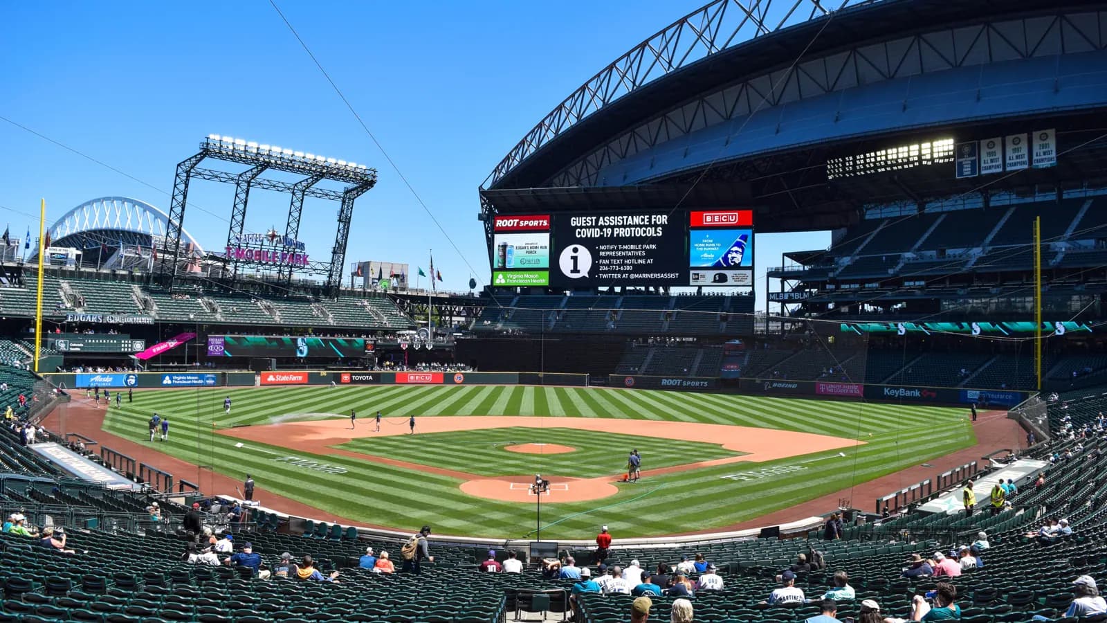 Wide view across the field, retractable roof, and T-Mobile Park sign in Seattle.