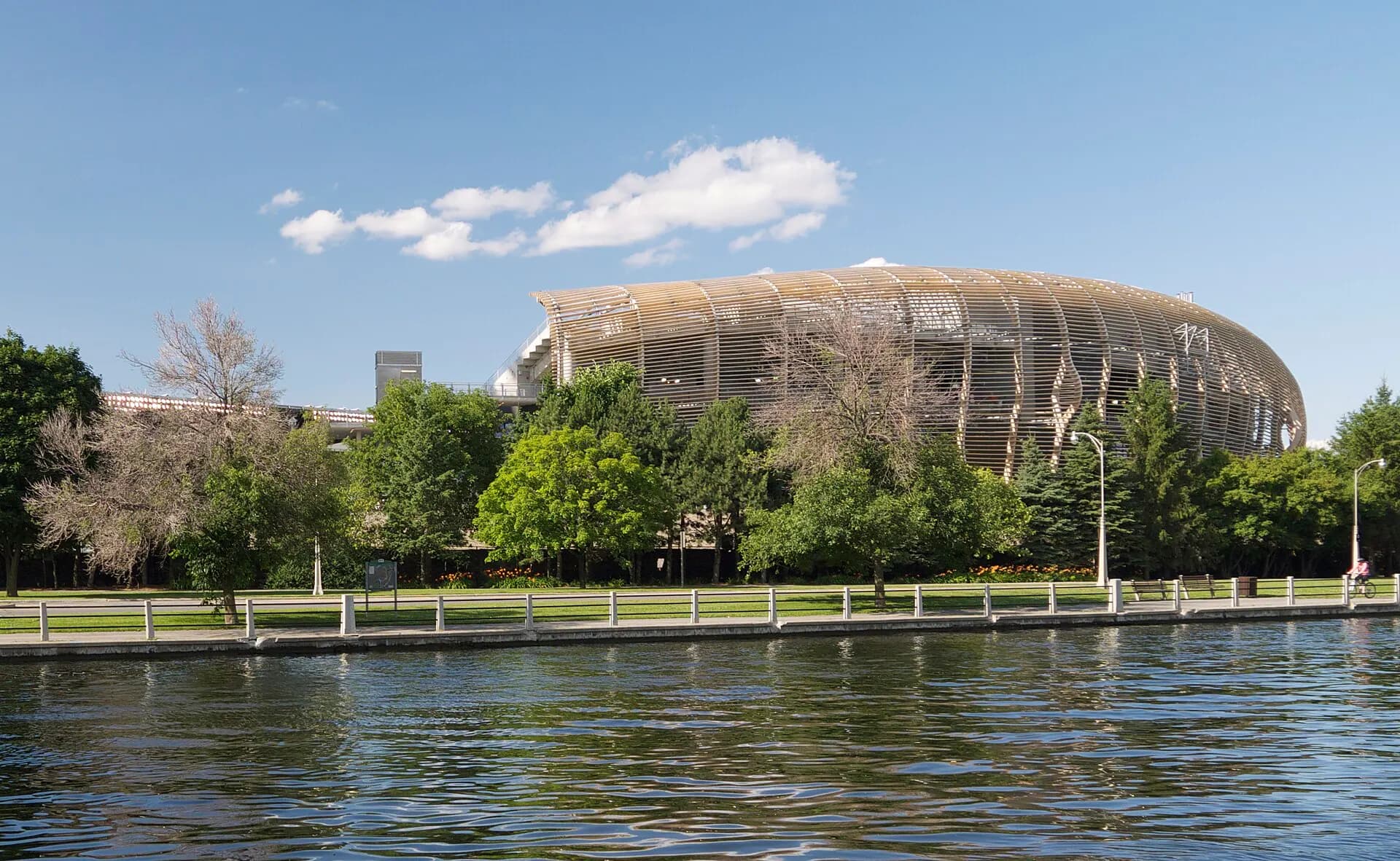 Full exterior view of TD Place Stadium from the Rideau Canal in Ottawa