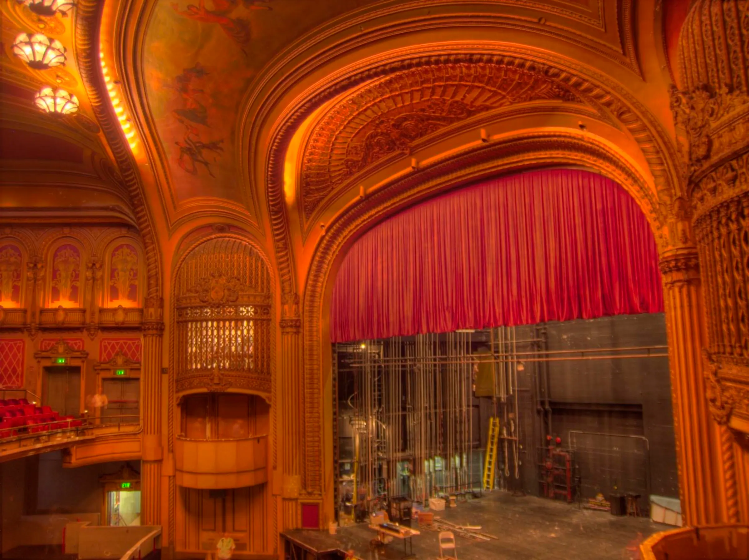 Wide interior view across The Warfield's ornate proscenium, stage, side boxes, and nearby seating.