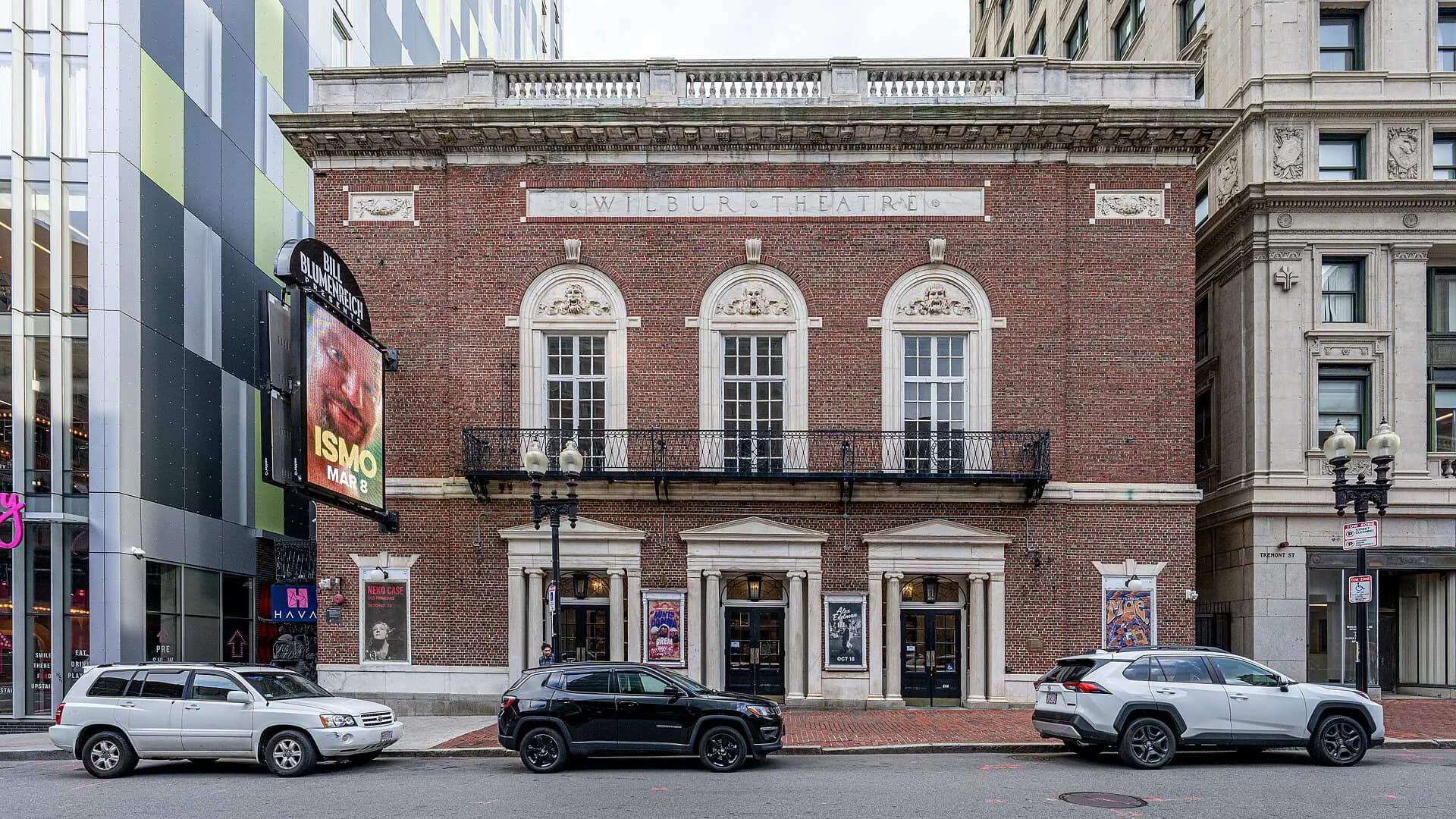 Wide exterior view of The Wilbur facade and marquee in Boston's Theatre District.
