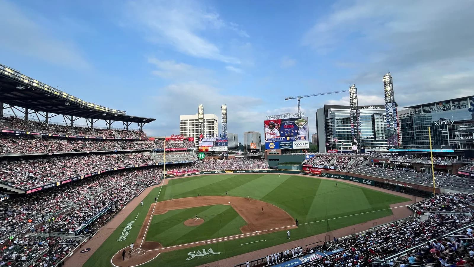 Wide game-day view across Truist Park with the current name visible above the scoreboard.