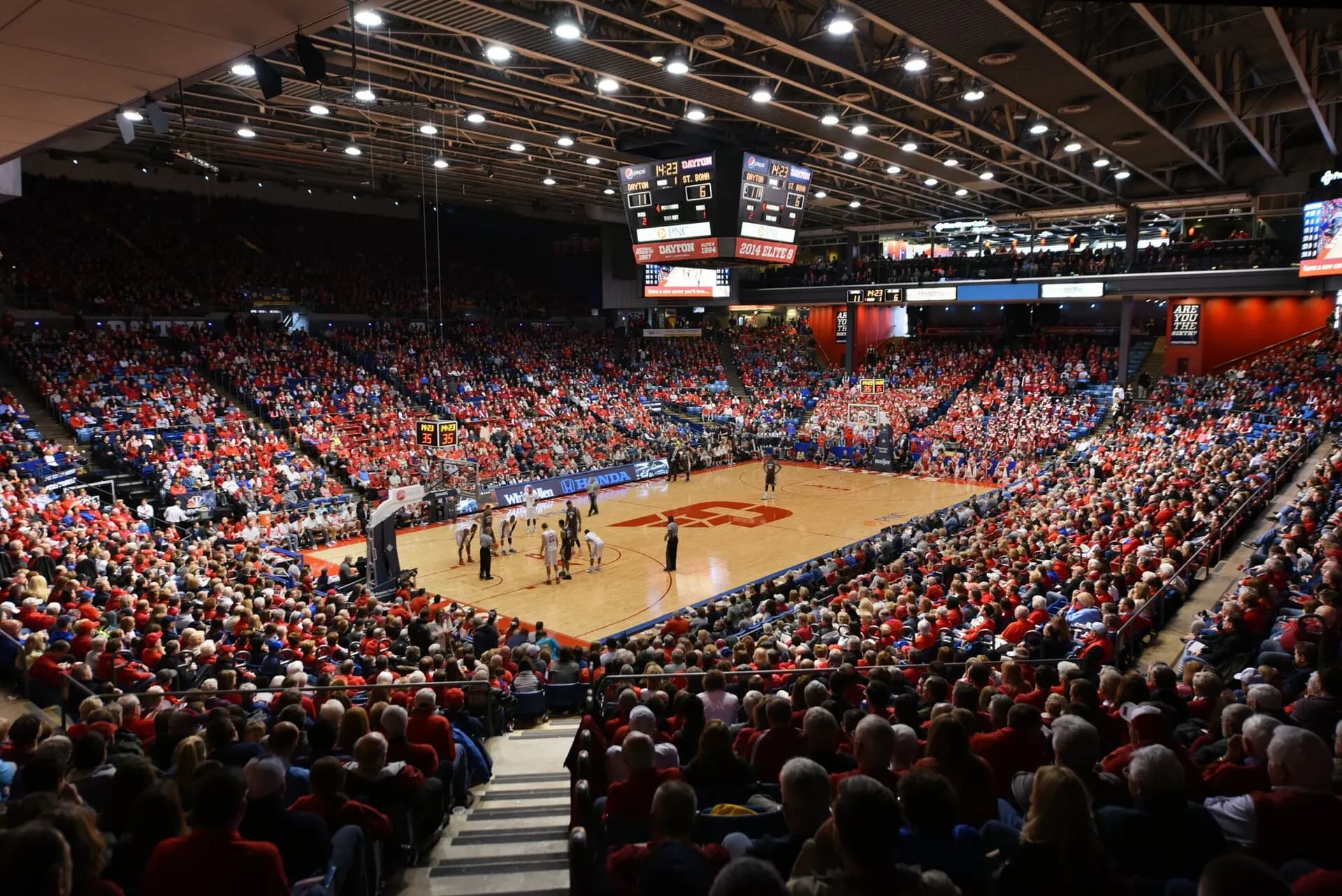 Wide interior view of the court and complete seating bowl at University of Dayton Arena.