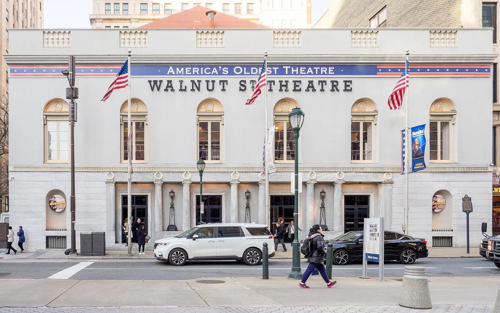 Street-level view of the full Walnut Street Theatre facade and entrances.