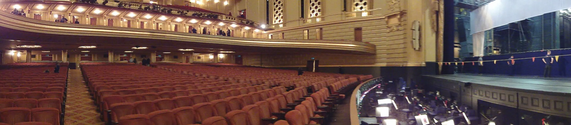 A panoramic view across the War Memorial Opera House stage, boxes, and multi-level auditorium.