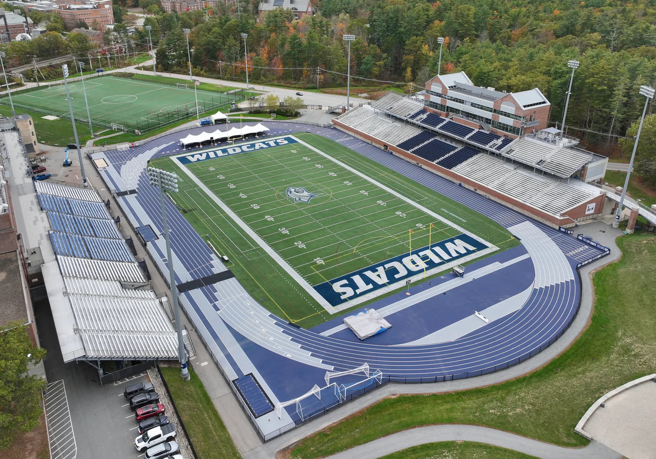 UNH Wildcat Stadium’s rebuilt grandstand and blue track in an aerial photographed by Quintin Soloviev on October 13, 2025.