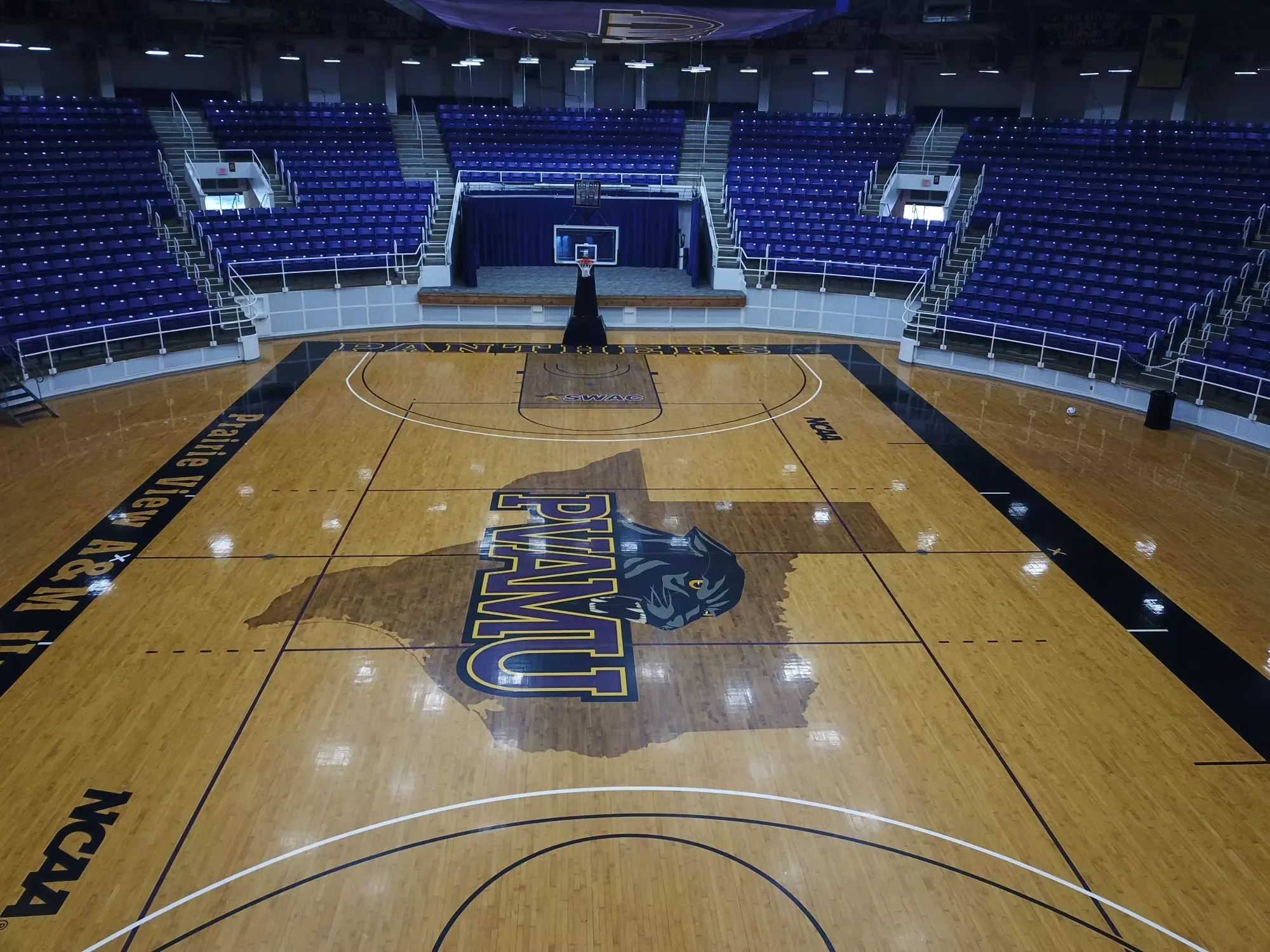 William J. Nicks Building’s basketball bowl in Prairie View A&M’s December 2024-source facility collection. The elevated baseline perspective shows the PVAMU court, purple chairbacks, aisles and opposite basket. It is a general arena view without a section-and-row label; capture date is unverified.