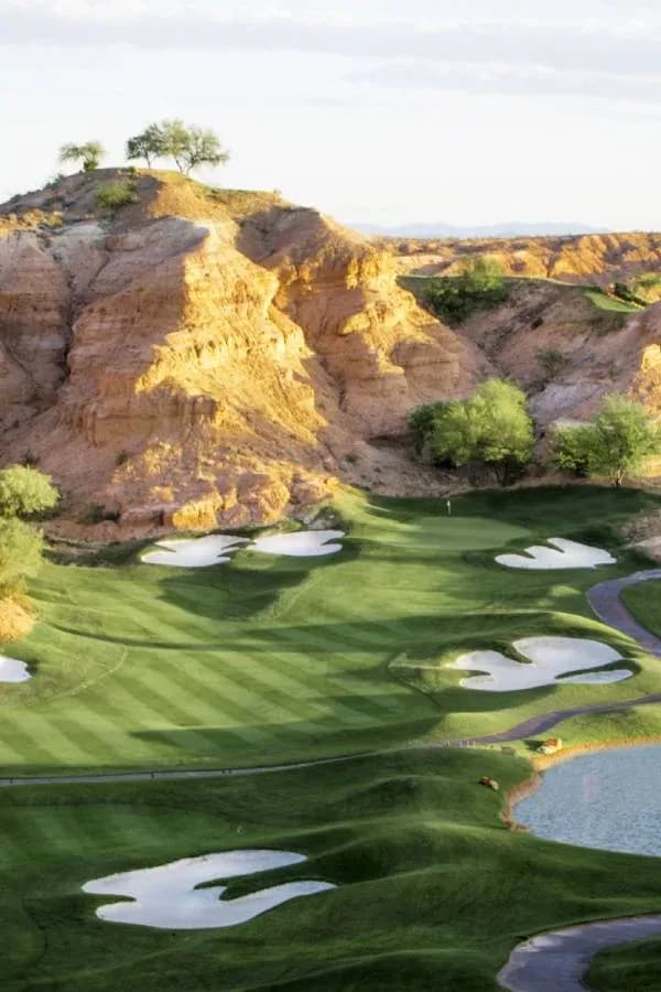 Green and desert cliffs at Wolf Creek Golf Club.