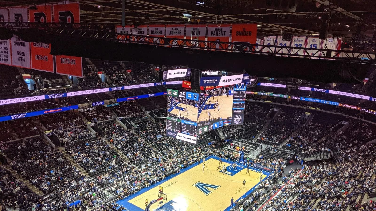 Wide interior view of the Philadelphia arena during a basketball game.