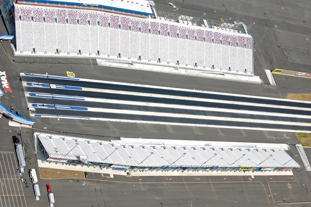 Aerial view of the four-lane racing surface and grandstands at zMAX Dragway